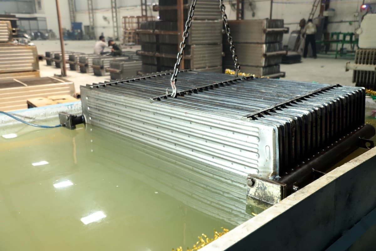 Radiator submerged in the leak and pressure test tank