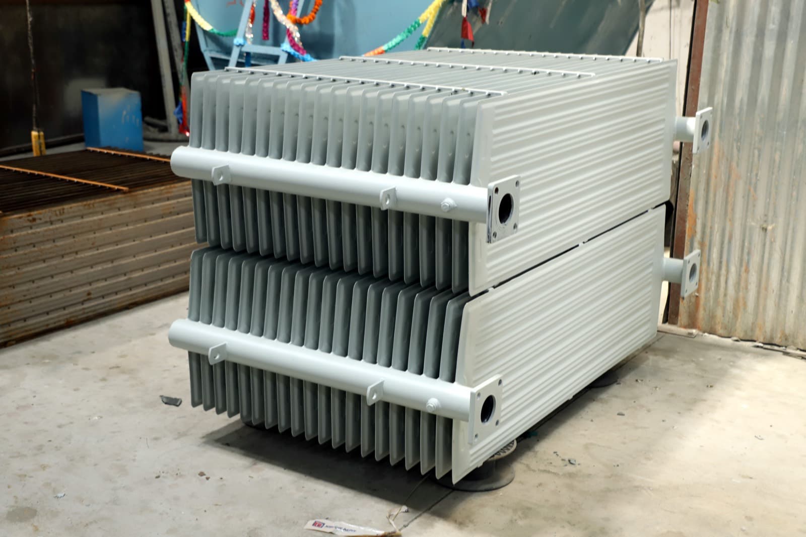 Pressed steel radiators — paired finished units
