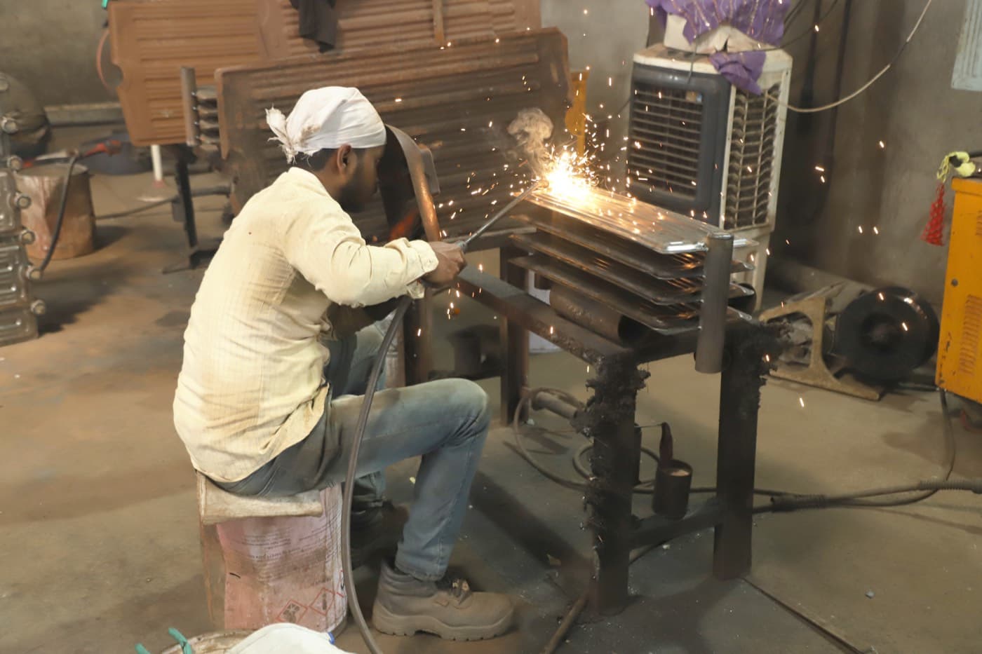 Fabricators checking panel dimensions against the drawing